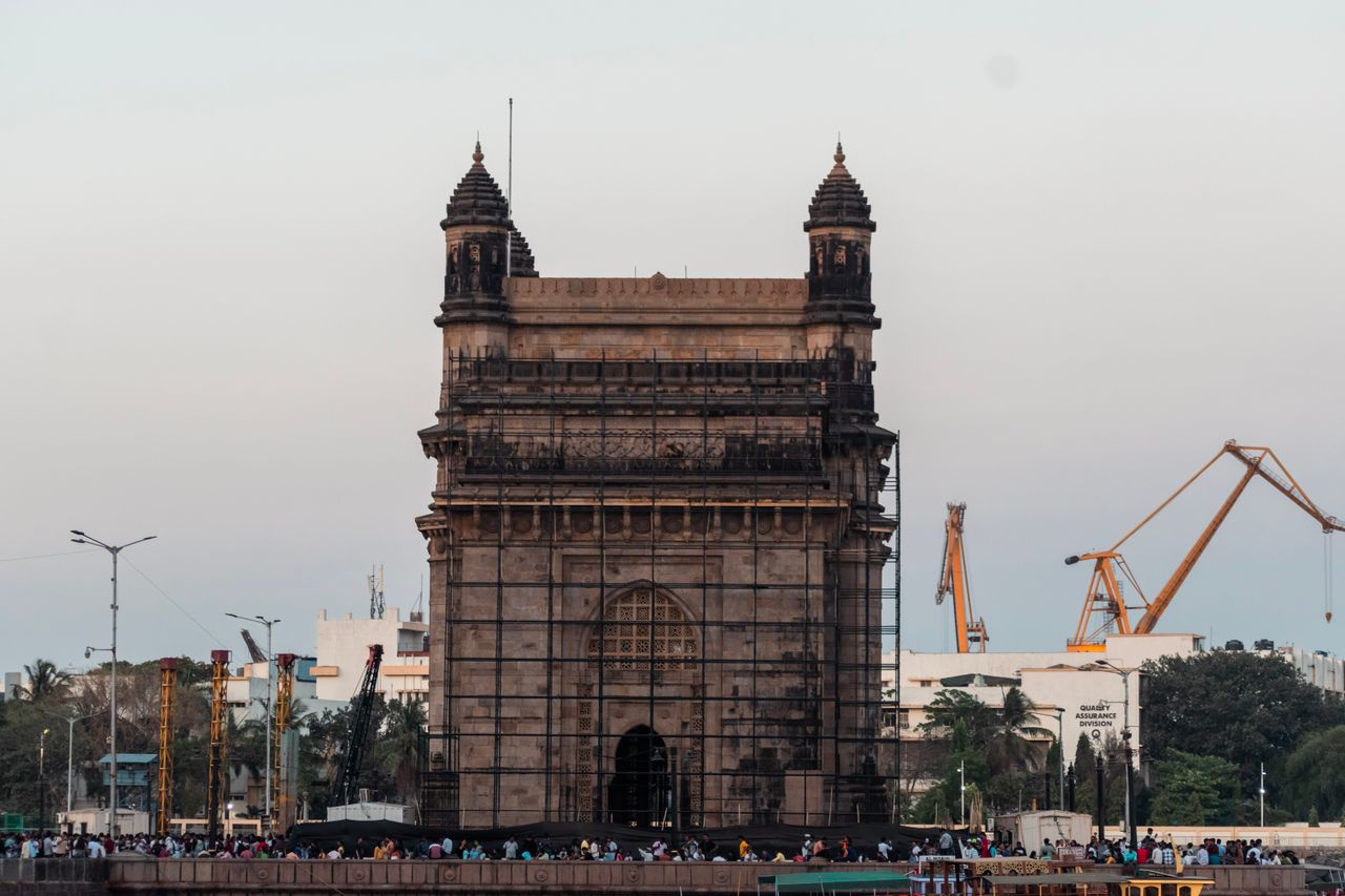 The Gateway of India at sunset with the Arabian Sea behind it